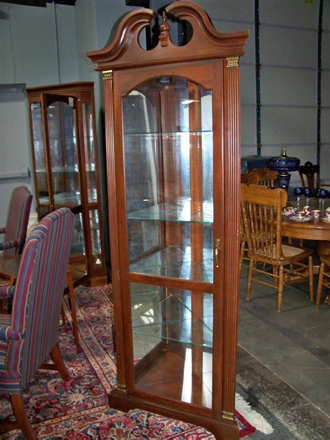 The minutes of each meeting are submitted to the board members prior to, and are approved, at the meeting the following month. Lot - Mahogany Corner Display Cabinet with Broken Arch Top