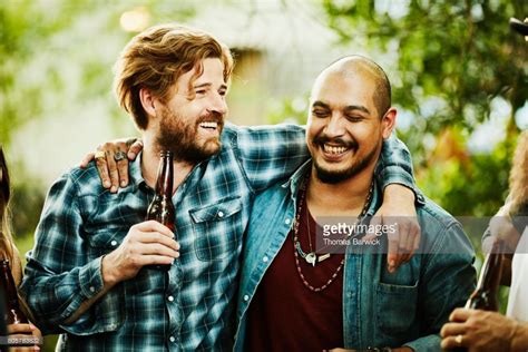 Stock Photo Laughing Friends With Arms Around Each Others Shoulders