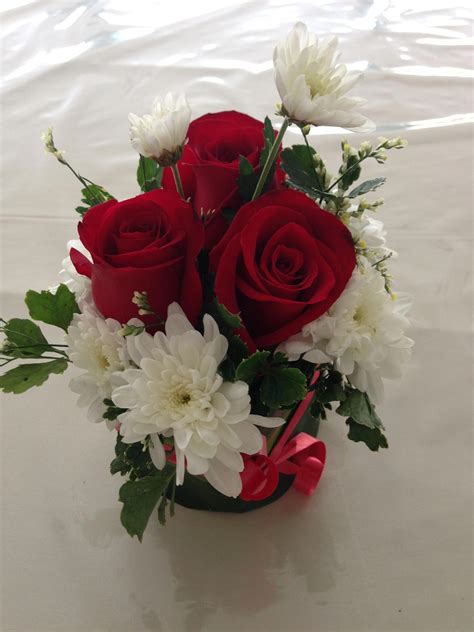Small Table Arrangement Of Red Roses And White Mums