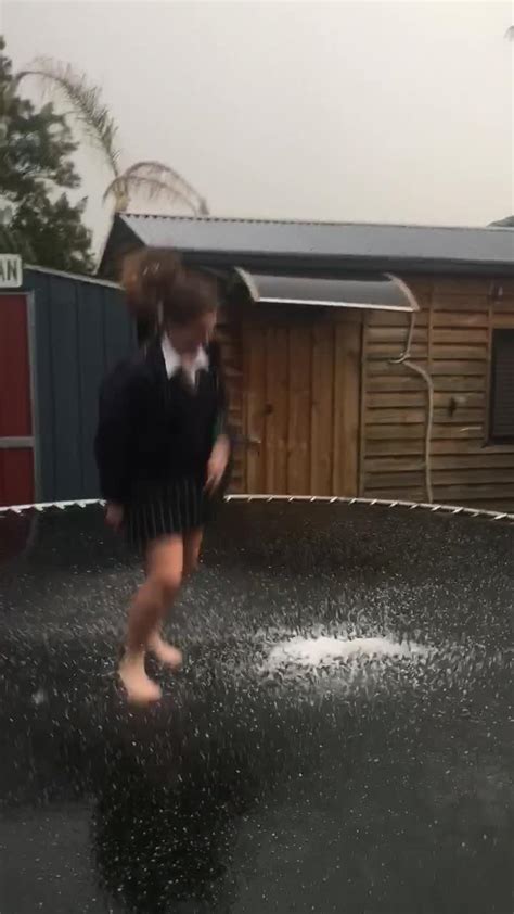 Girl Jumping Over Hail Covered Trampoline Slips And Faceplants Jukin Licensing