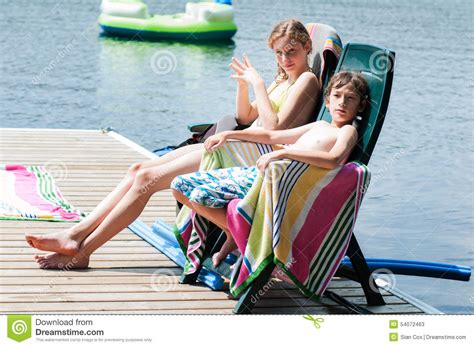 Sunbathing By A Lake Stock Image Image Of Sitting Cottage 54072463