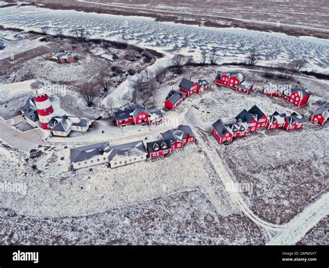 Wooden Red Houses Of Fishing Village In Snowy Covered In Winter