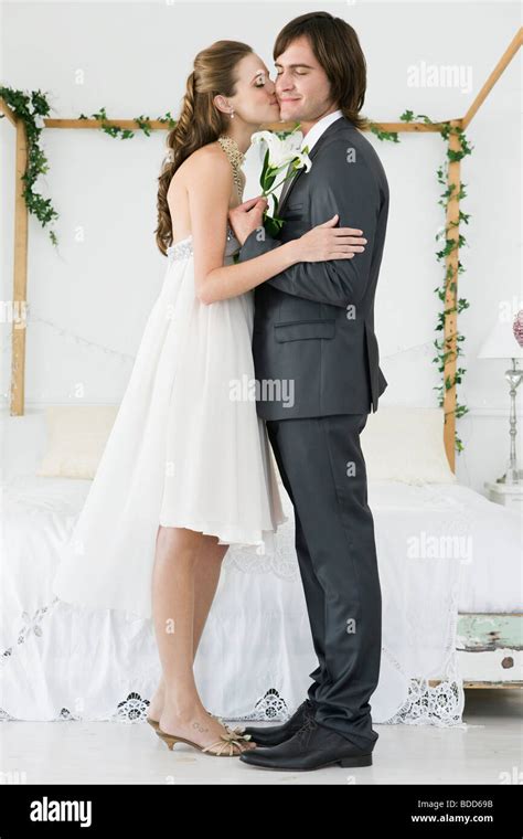 Bride Kissing Groom Stock Photo Alamy