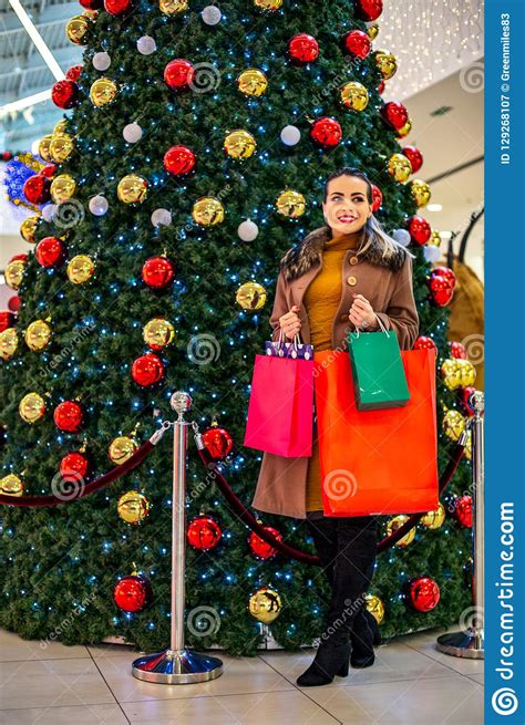 Consumerism, Christmas, Shopping, Lifestyle Concept Woman In Shopping. Woman With Shopping Bags ...