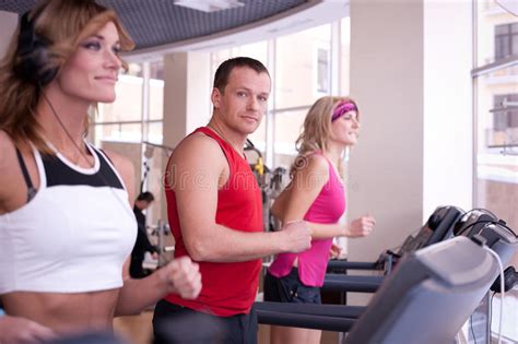 Personal Trainer Instructing Woman On Treadmill Stock Image Image Of