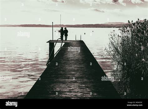 Silhouette Of Man Standing On Pier Stock Photo Alamy