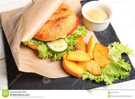 Tasty Burger And Fries Served On Slate Plate Stock Photo Image Of