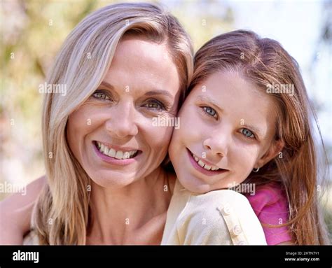 Shes My Angel A Smiling Mother With Her Daughter On Her Back While