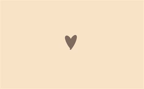 A Black Heart On A Beige Background With The Word Love Written In It S Center