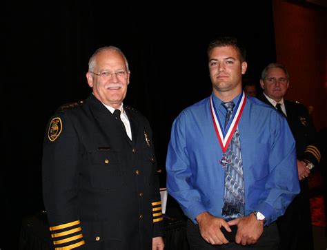 officer e rosky receives a lifesaving medal for his actions in 2007 police department officer