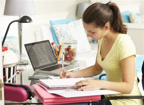 Teenage Girl Studying At Desk In Bedroom Stock Photo Image Of File
