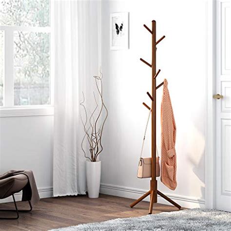 Hat stand and coat hanger are semantically related. LANGRIA Rubber Wood Coat Rack Stand Hat Hanger Tree Holder ...