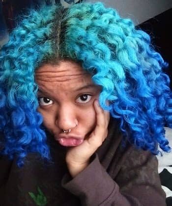 Let your curls loose, but keep your face framed with gelled baby hairs to highlight killer brows. 10 Women Who Rock Blue Hair So Well