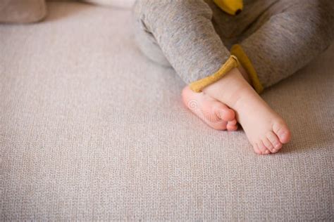 Close Up Baby Legs Baby Feet On The Sofa Stock Photo Image Of People