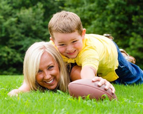 Mother And Son Playing Football Outdoors Stock Image Image Of Person Generation 32507063