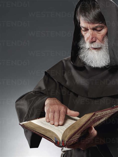 Monk Reading The Bible Stock Photo