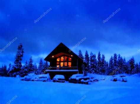 Winter Cabin At Night With Glowing Warm Windows — Stock