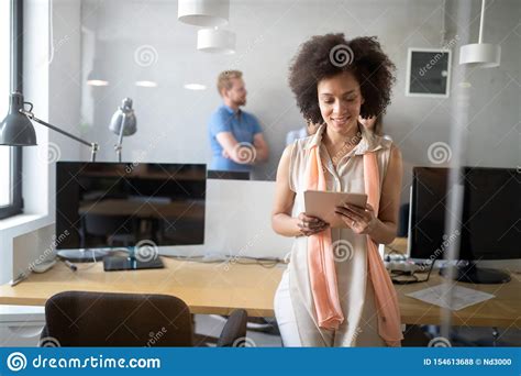Young African American Woman Working With Tablet In Office Stock Photo