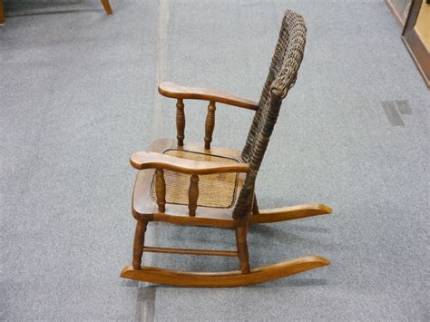 I like antique, old furniture items. Vintage Kid's Wicker Rocking Chair | Lincoln Park Emporium