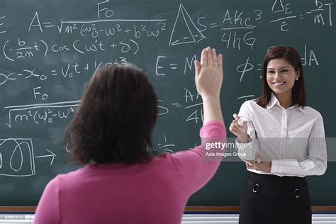 Adult Student Raising Hand For Teacher High Res Stock Photo Getty Images