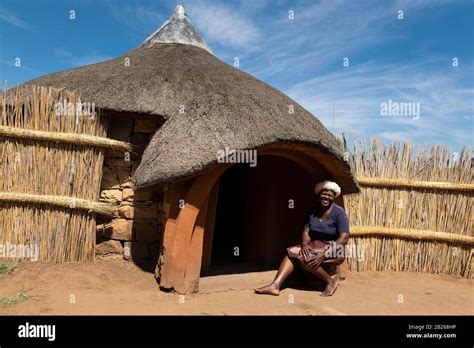Basotho Woman In Front Of Traditional Hut Thaba Bosiu Cultural Village