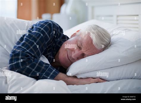 Senior Man Sleeping In Bed Stock Photo Alamy
