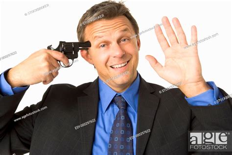 Businessman Holding Gun To His Head While Smiling And Waving Stock