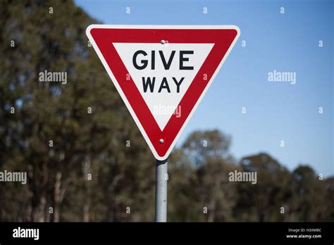 Give Way Sign Give Way Or Yield To Oncoming Traffic Stock Photo Alamy