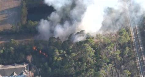 Florida Forest Service, St. Johns County Fire Rescue mop up half-acre