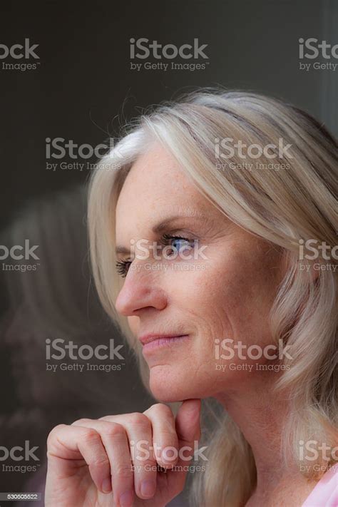 Portrait Of A Beautiful Mature Lady Deep In Reverie Contemplation Stock