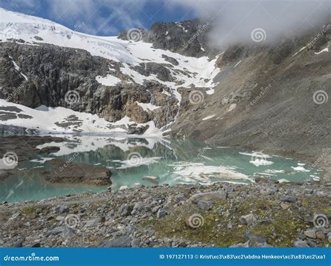 Summer View Of The Sulzenauferner Glacier And Turquoise Glacial Lake