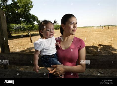 Ana Espinoza And Her Month Old Daughter Ximena Outside Her Home In
