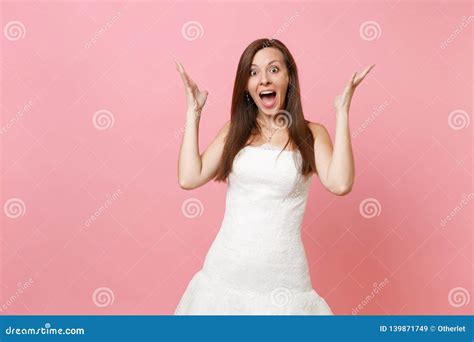 Portrait Of Pretty Amazed Surprised Bride Woman In Exquisite White