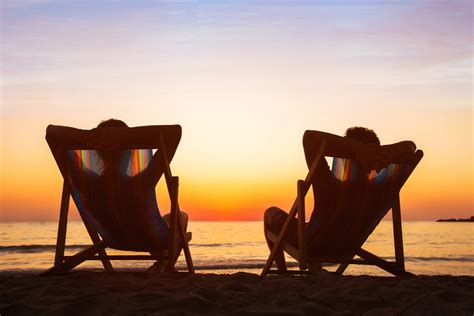 Happy Couple Relaxing In Beach Hotel At Sunset Honeymoon Unbridled
