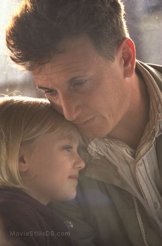 She abandons them as soon as they leave the hospital. I Am Sam - Publicity still of Dakota Fanning & Sean Penn