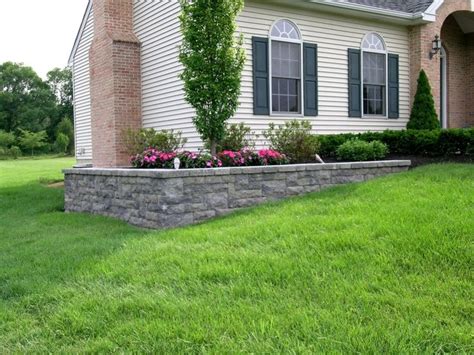 A Retaining Wall Is Used On This Project To Level The Planting Bed Of