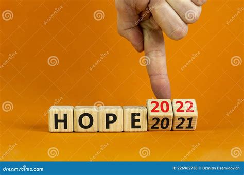 2022 Hope New Year Symbol Businessman Turns A Wooden Cube And Changes