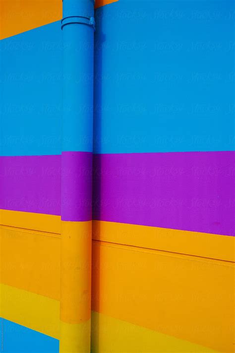 "Blue Purple Yellow Orange At Horizontal Strip Of Wall Background" by