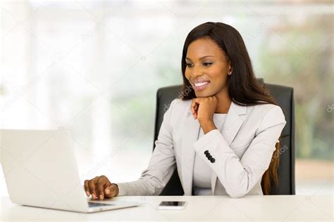 Young African Business Woman In Office — Stock Photo © Michaeljung