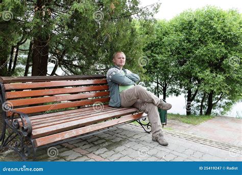 Man Resting On Bench Stock Image Image Of Comfortable 25419247