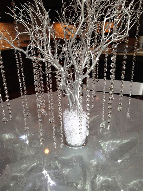 Table Centerpiece With Silver Branches Crystals And A Light Embedded