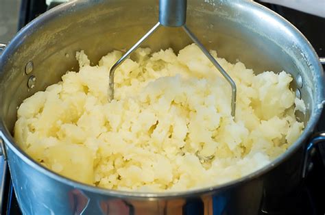Drain into a colander and transfer the potatoes back into the pot and start mashing. Delicious, Creamy Mashed Potatoes | The Pioneer Woman ...