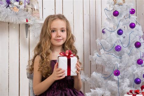 Little Girl With Christmas Present Stock Photo Image Of Cheerful