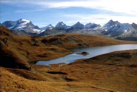 Rosset Lake From The Slopes Of Gran Vaudala And Gran Paradiso Range In