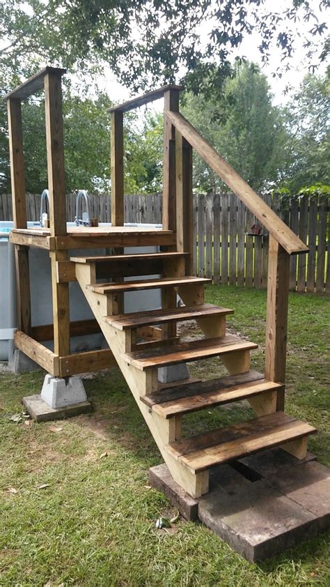 To build a deck for an above ground pool, you need to make a good base. Pool access platform w/repurposed pool ladder (going into pool) … | Pool steps, Backyard pool ...