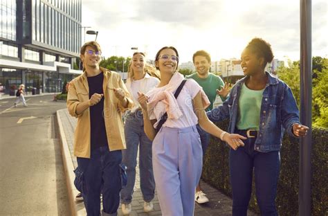 Group Of Fun And Cool Friends Hang Out Together Walking Streets In