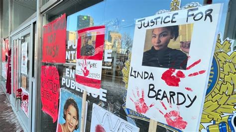 Posters Urging Action Broken Window Left At Winnipeg Police Hq After Rally For Woman Found Dead