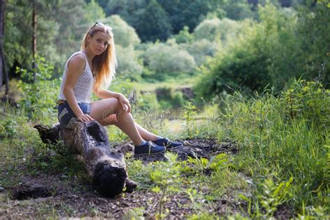 Girl Sitting On A Tree Stump In The Forest Stock Image Image Of Female Pink