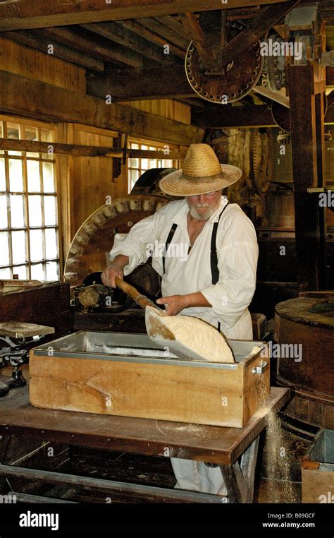 Miller Grinding Corn In Old Grist Mill Spring Mill State Park Indiana