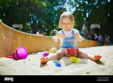 Adorable Little Girl Having Fun On Playground In Sandpit Toddler